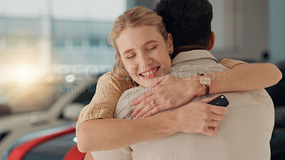 Buy stock photo Hug, couple or excited woman with keys at dealership for purchase success, hiring transport or buyer. Embrace, celebrate or happy customers with smile for automobile, car loan or rental agreement