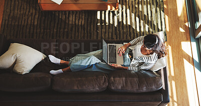 Computer, sofa and above of woman in home for research, browse website and internet, Relax, living room and top view of person on laptop for typing email, connection and communication in house