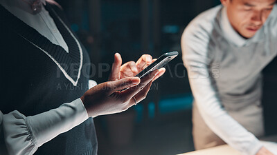 Buy stock photo Hands, meeting and phone with business people in office boardroom at night for planning together. App, collaboration and scrolling with employee team in professional workplace for evening deadline