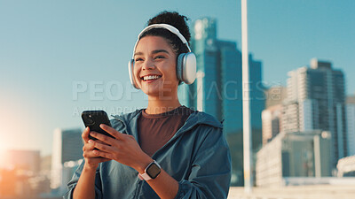 Buy stock photo Fitness, music and phone with woman in city for break from cardio training or running. Exercise, headphones and smile with athlete or runner outdoor in urban town for sports, vision or workout