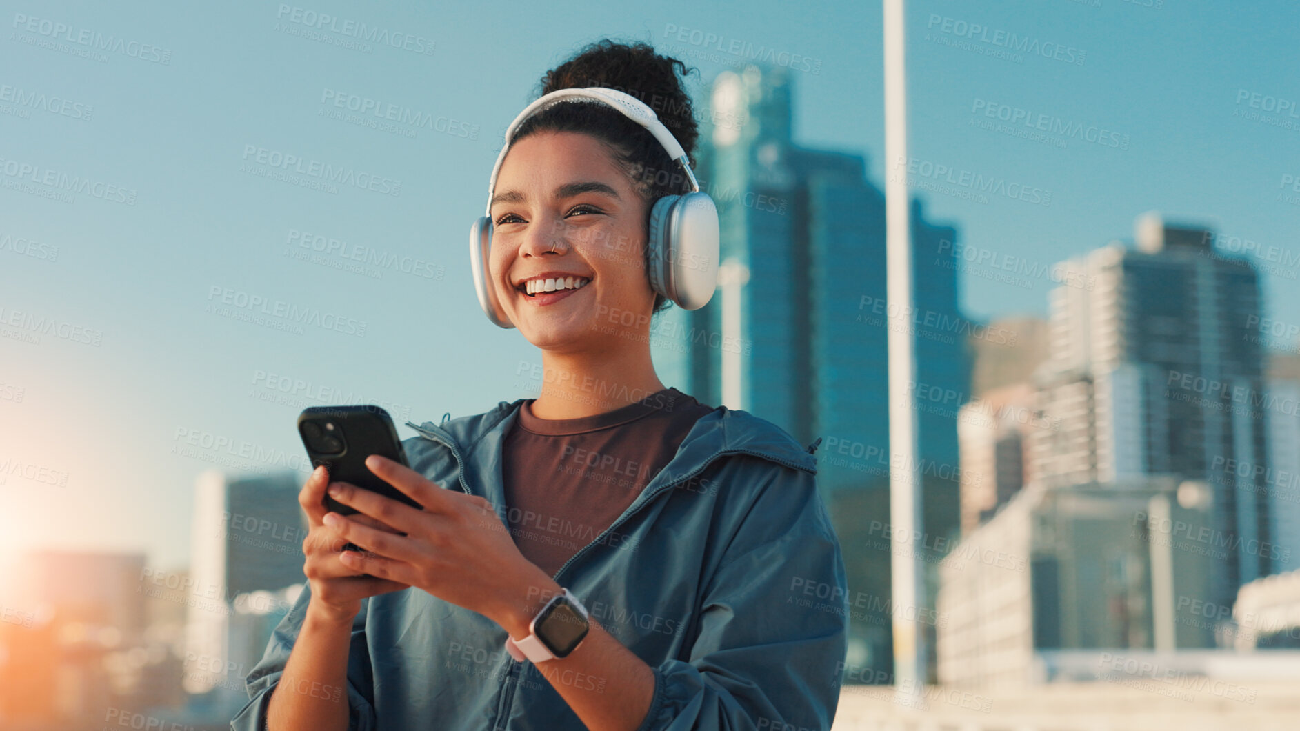 Buy stock photo Fitness, music and phone with woman in city for break from cardio training or running. Exercise, headphones and smile with athlete or runner outdoor in urban town for sports, vision or workout