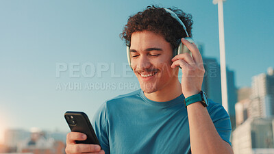 Buy stock photo Fitness, music and phone with man in city for cardio routine, marathon training or workout challenge. Exercise, headphones and smile of happy athlete or runner outdoor in urban town for streaming