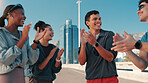 Happy people, fitness and huddle with applause in city for workout goals, motivation or success. Active, group or friends clapping with smile for teamwork, exercise or achievement in an urban town