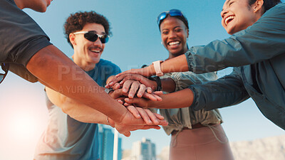 Buy stock photo Happy friends, fitness or city with hands together for motivation, teamwork or unity. Active, people or group piling with smile or stack in huddle for workout, exercise or health and wellness in town