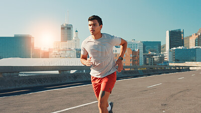 Buy stock photo Man, running and fitness with city street for workout, cardio exercise or outdoor training. Active, male person or runner with lens flare on road for physical activity, health or wellness in town