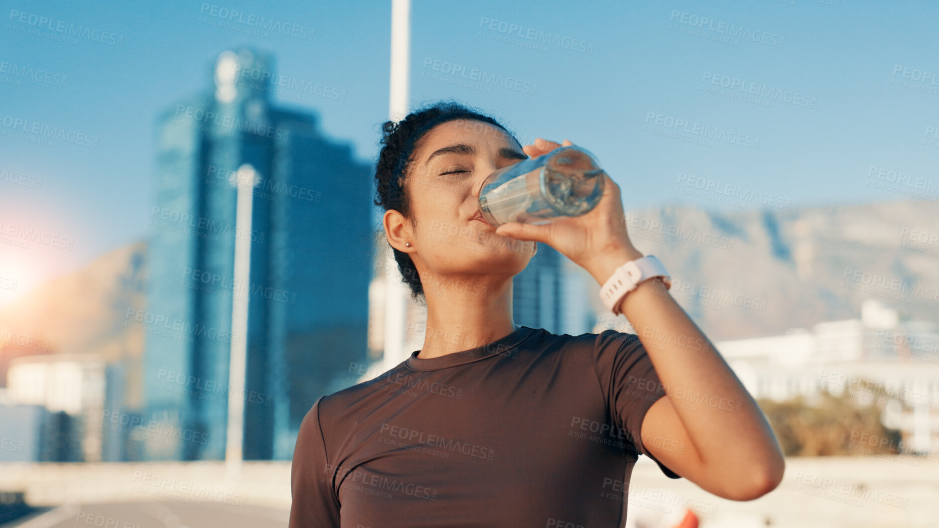 Buy stock photo Woman, fitness or drinking water in city for hydration, natural sustainability or refreshment. Active, female person or thirsty runner with mineral liquid or aqua beverage for recovery, rest or break