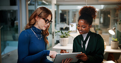 Buy stock photo Happy women, designers or night with tablet for research, project or development at office. Female people, employees or colleagues working late with smile on technology for business idea at workplace
