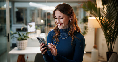 Buy stock photo Cellphone, business and happy woman in office at night for communication, contact or funny email. Female employee, tech and scroll for feedback, social media joke or finished deadline or overtime