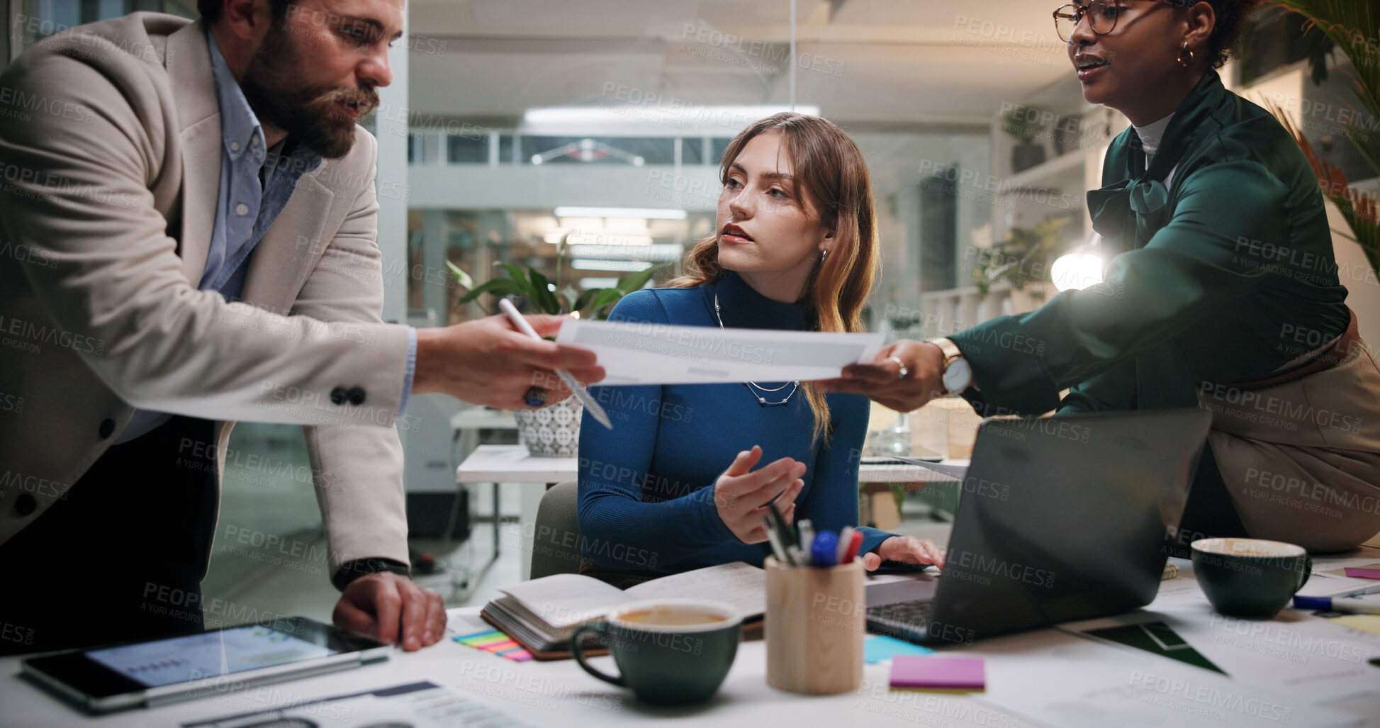 Buy stock photo Creative, teamwork or planning with documents in office at night for marketing campaign, design feedback or strategy. Graphic designer, people and discussion for brand development, ideas and overtime