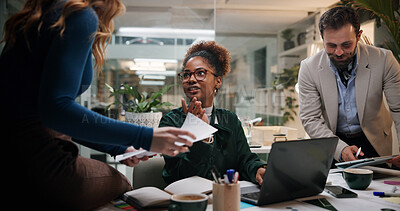 Buy stock photo Woman, document and team in office for business, project feedback and review advice at night. Journalist people, paper and tech in agency for article discussion, collaboration and late information