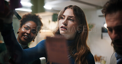 Buy stock photo Brainstorming, team and writing of ideas, office and colleagues with marketing strategy, planning and night. Business meeting, overtime and people with sticky notes for collaboration and working late
