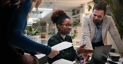 Buy stock photo Business people, laptop and meeting in office for discussion, project feedback and advice at night. Journalist team, paper and tech in agency for article review, collaboration and late information