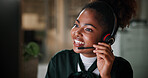 Black woman, smile and computer in call centre at night for contact us, online assistance and advice. Agent, headset and pc with instructions for solution, customer service and feedback for overtime