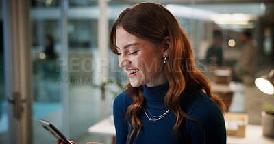 Buy stock photo Business woman, cellphone and laugh in office at night for communication, contact or funny email. Female employee, technology and happy with online feedback, social media silly meme and deadline