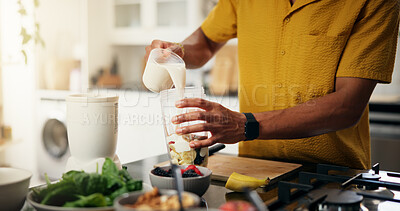 Buy stock photo Cooking, hands and smoothie with man in kitchen of home for hobby, meal prep or nutrition. Ingredients, passion or recipe and person with blender in apartment for breakfast, diet or health as chef