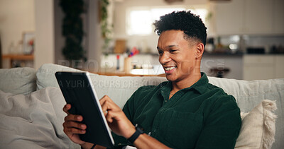 Buy stock photo Relax, smile and tablet with man on sofa for social media, movie platform and streaming service. Happiness, entertainment app and subscription with person in living room at home for multimedia search