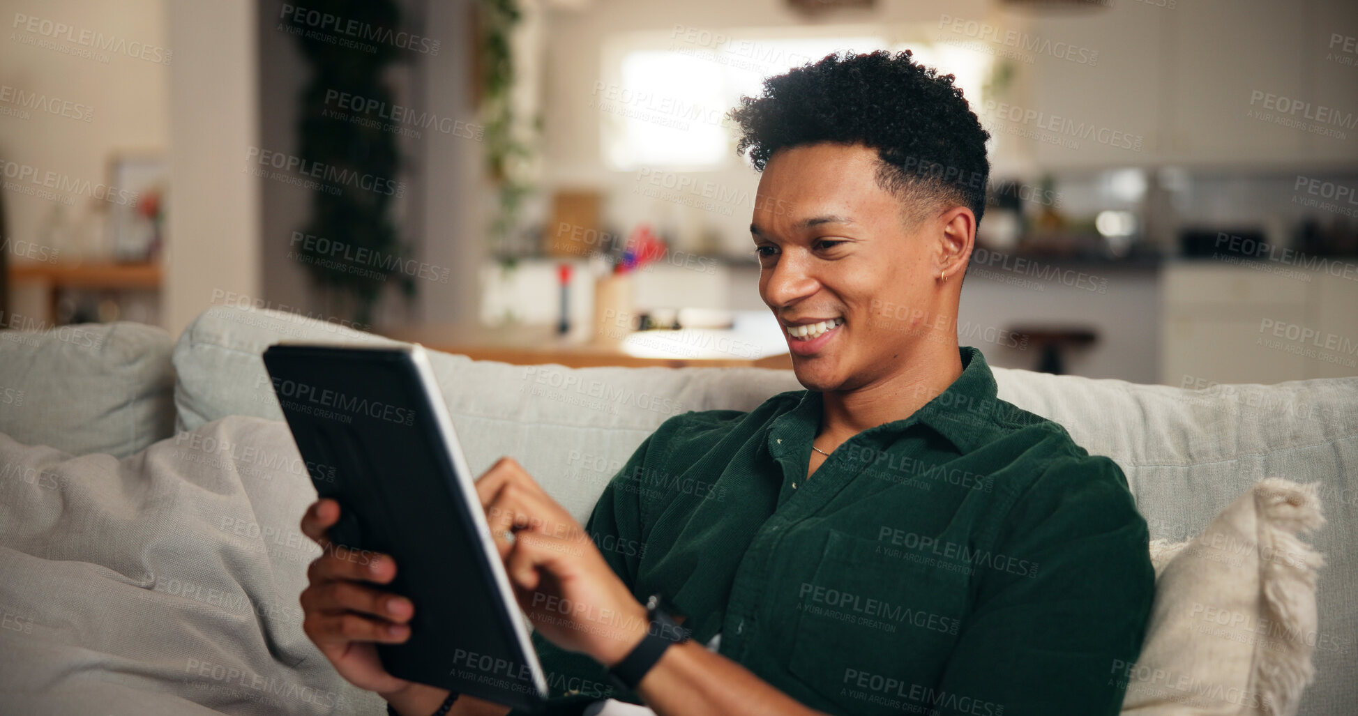 Buy stock photo Relax, smile and tablet with man on sofa for social media, movie platform and streaming service. Happiness, entertainment app and subscription with person in living room at home for multimedia search