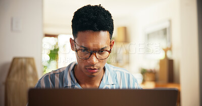 Buy stock photo Man, reading and laptop for remote work at house for research, proofreading article and information. Journalist, online and review news for story update, editing draft and schedule for publication