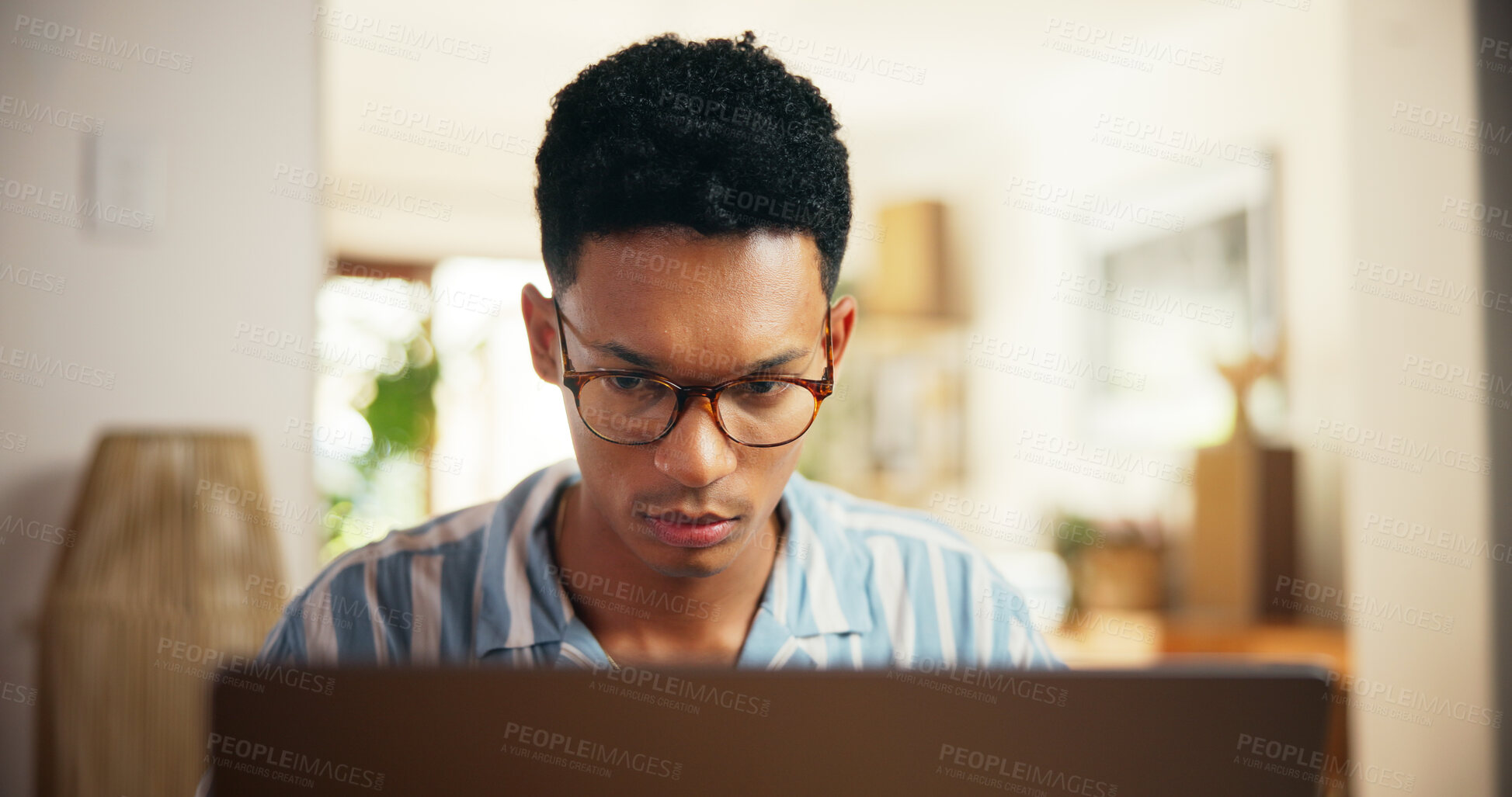 Buy stock photo Man, reading and laptop for remote work at house for research, proofreading article and information. Journalist, online and review news for story update, editing draft and schedule for publication