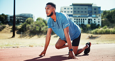 Buy stock photo Ready, sports and athlete or man on running track for fitness, training and cardio performance. Health, marathon and runner with person and outdoor stadium for competition, start and workout