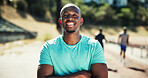 Portrait, athlete and black man with pride at stadium for exercise, sports training and practice on track field. Male runner, arms crossed and fitness for workout, endurance and challenge of marathon