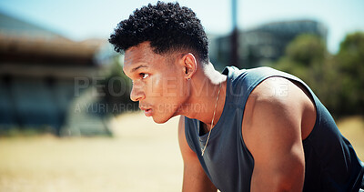 Buy stock photo Ready, competition and athlete or man on race track for fitness, training and cardio performance. Health, marathon and sports runner with person and outdoor stadium for running, start and workout
