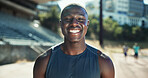Portrait, athlete and black man with smile at stadium for exercise, sports training and practice on field. Male runner, happy and confidence for fitness, workout and endurance for marathon challenge