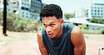 Athlete, man and tired with breathing at stadium for running fatigue, endurance challenge or race competition burnout. Fitness, runner and sweating outdoor for marathon recovery, workout or exhausted