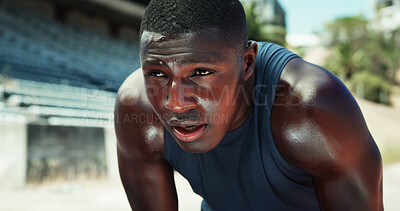 Buy stock photo Fitness, black man and tired with breathing at stadium for race performance, endurance challenge and sweating. Runner, athlete and exhausted outdoor with running recovery, marathon rest and burnout