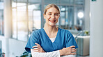 Arms crossed, medical and portrait of woman nurse in hospital for appointment, checkup or treatment. Happy, healthcare and scrubs with friendly medicine professional in clinic for medicare or therapy