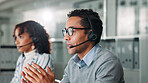 Consulting, contact us and support with man in call center for assistance, feedback or online help. Coworking, explain and headset with virtual assistant at desk in office for customer service