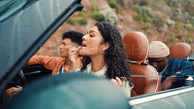 Buy stock photo Check, lipstick and road trip with people in car together for holiday, travel or vacation. Drive, freedom and makeup with group of friends getting ready in convertible vehicle for weekend getaway