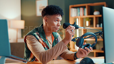Buy stock photo Content creator, headphones and man live streaming for review, podcast or social media promo. Filming, product or influencer show technology for advertising, vlog or opinion for gaming gear at home