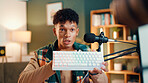 Content creator, keyboard and man with microphone for review, podcast or social media promotion. Filming, product and influencer show tech for live streaming, opinion or gaming gear with RGB at home