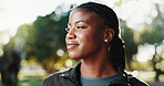 Fitness, thinking and black woman at park on break for relax, health or wellness with inspiration. Smile, thoughts or sports athlete outdoor with reflection, decision or vision with idea for exercise