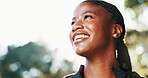 Outdoor, hiking and happy black woman with nature, smile and wellness for hobby, explore and travel. Thinking, hiker and person with woods, vacation activity and sightseeing for environment and break