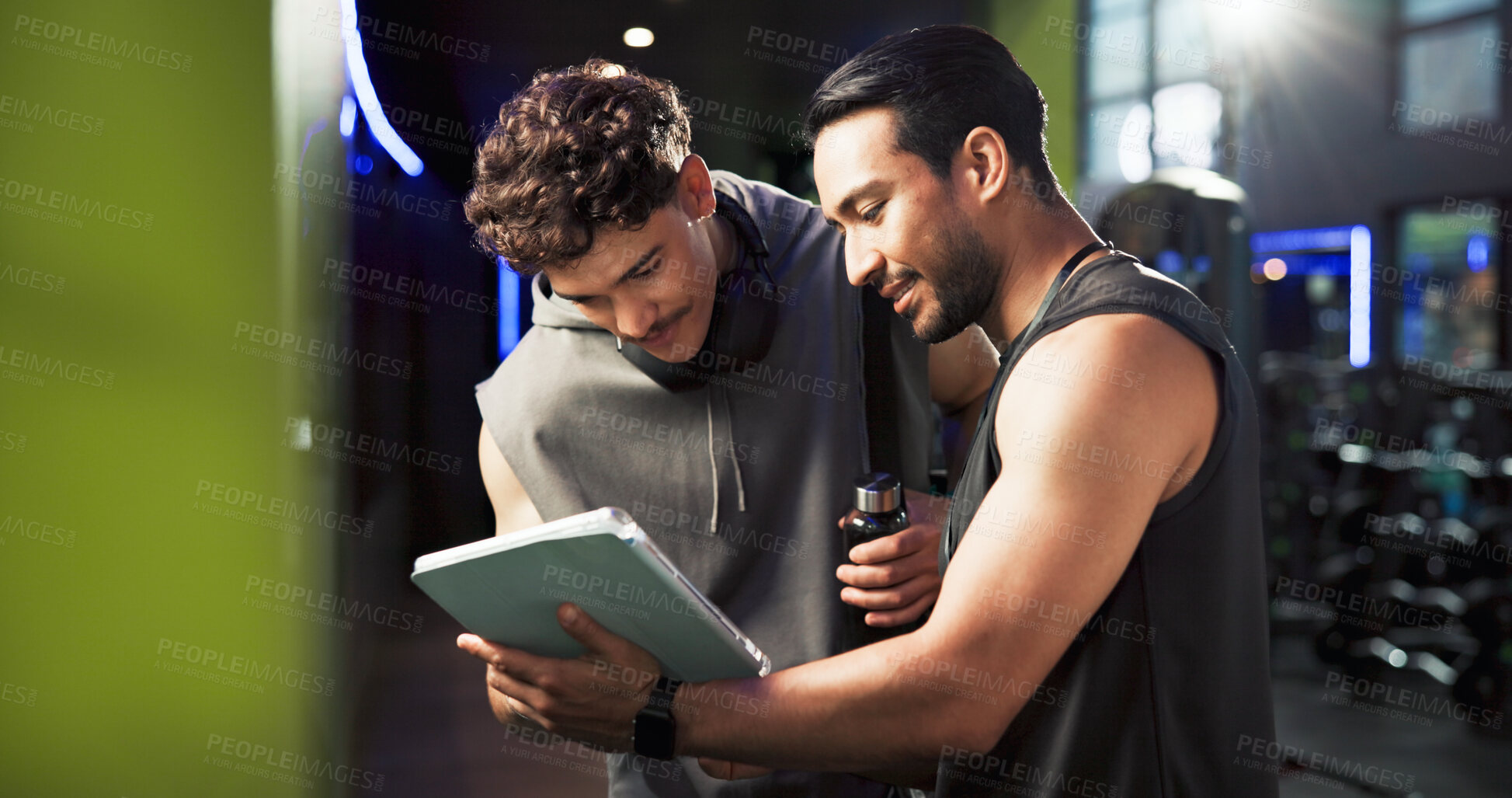 Buy stock photo Men, personal trainer and tablet with talking at gym with smile, sign up and listening with exercise tips. People, coach and touchscreen with app for training, registration or offer at fitness center