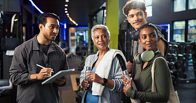 Buy stock photo Personal trainer, talking and group with membership in gym, explaining and info for training routine. Wellness, instructor and man with tablet for digital sign up, online and benefits of health club
