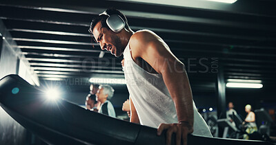 Buy stock photo Man, treadmill and tired with sweat at gym with exercise, headphones and speed with break at training center. Person, running machine and fatigue with workout, breathing and burnout at fitness club