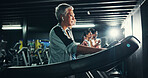 Health, earphones and music with woman on treadmill for workout playlist, training club and runner. Streaming, exercise and fitness podcast with mature person on running machine for radio and gym