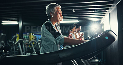 Buy stock photo Health, earphones and music with woman on treadmill for workout playlist, training club and runner. Streaming, exercise and fitness podcast with mature person on running machine for radio and gym