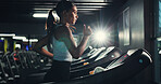 Exercise, girl and running on treadmill in gym at night for agility training, speed development or calorie burning. Flare, evening workout or woman on machine for cardio fitness or muscle performance