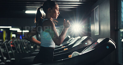 Buy stock photo Exercise, girl and running on treadmill in gym at night for agility training, speed development or calorie burning. Flare, evening workout or woman on machine for cardio fitness or muscle performance