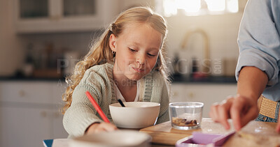 Buy stock photo Girl, child and drawing in kitchen at breakfast with parent, help and eating with bonding, care and love. People, kid and food in morning with writing, notes and learning with eduction in family home