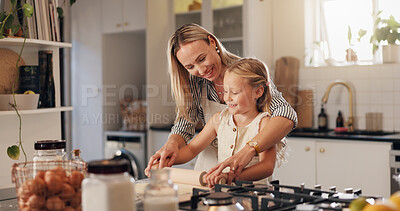 Buy stock photo Baking, woman and child with rolling pin in kitchen, learn and helping mom with dough or culinary skills. Cooking, mother and daughter with flour for meal prep, growth and development of kid in house