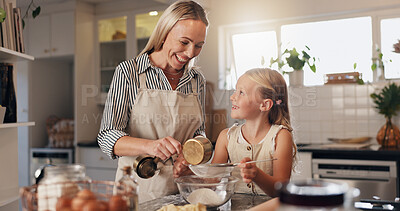 Buy stock photo Baking, mother and child with ingredients in kitchen, teaching and helping for dessert or meal prep. Cooking, woman and daughter with flour for culinary skills, growth and development of kid in home