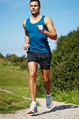 Buy stock photo Running, athlete and man for fitness and sports with energy for practice, exercise and health in nature. Workout, runner and training for marathon, forest and performance of speed of male person