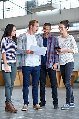 Buy stock photo Full length shot of a group of casual businesspeople in the office