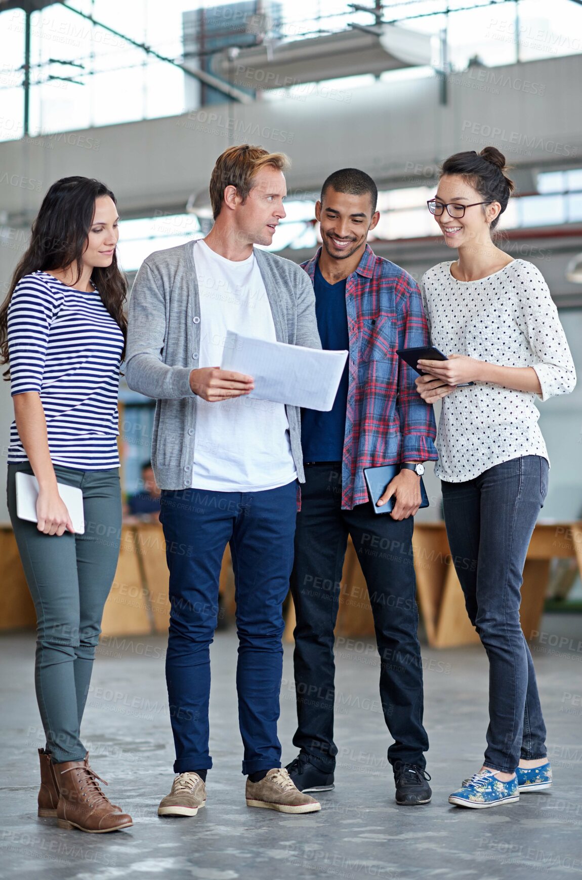 Buy stock photo Full length shot of a group of casual businesspeople in the office