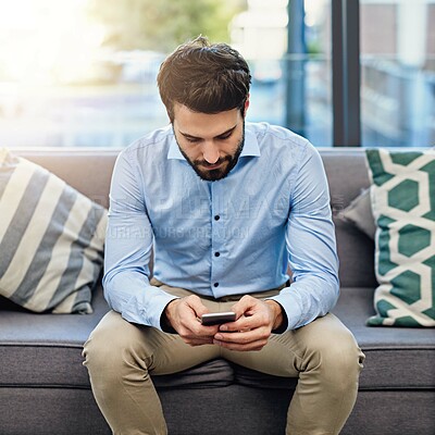 Buy stock photo Businessman, phone and typing on sofa in office for text message, mobile chat or work communication. Professional, employee and smartphone for email, online search or networking on couch at workplace
